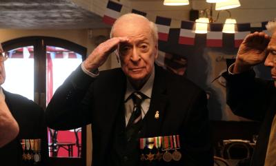Michael Caine giving a salute