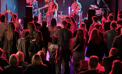 an image of a band at Rising Music Festival